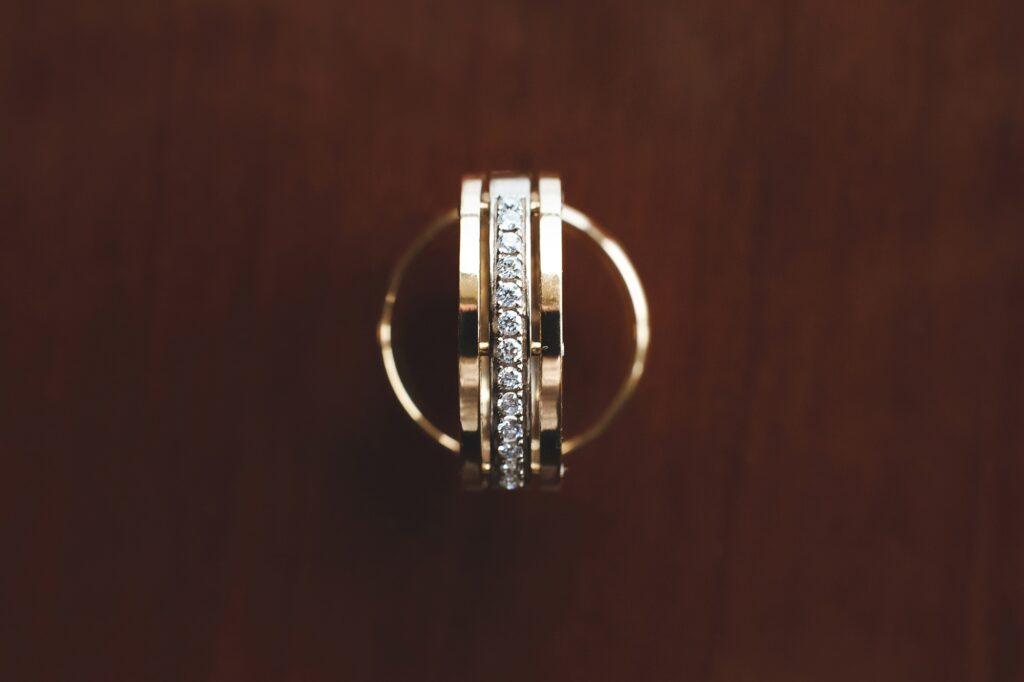 Wedding rings on wooden background